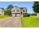 Charming two-story home with a brick and siding exterior and a well-maintained front yard at 4905 Martin Farms Dr, Powder Springs, GA 30127