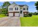 Charming two-story home with a brick and siding exterior and a well-maintained front yard at 4905 Martin Farms Dr, Powder Springs, GA 30127