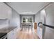 Eat-in kitchen with white cabinetry, stainless steel appliances, granite countertops, and ample seating at 4905 Martin Farms Dr, Powder Springs, GA 30127