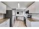 Modern kitchen with white cabinets, granite counters, stainless steel appliances, and subway tile backsplash at 4905 Martin Farms Dr, Powder Springs, GA 30127