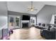 Cozy living room with a fireplace, vaulted ceiling, and access to a deck through French doors at 4905 Martin Farms Dr, Powder Springs, GA 30127