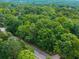 Private, tree-filled lot along a road, perfect for a secluded home at 5680 Whitner Dr, Atlanta, GA 30327