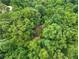 Heavily wooded lot provides ultimate privacy and a natural canopy for a secluded residence at 5680 Whitner Dr, Atlanta, GA 30327