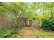 Charming home entrance with brick walkway and lush greenery offers inviting curb appeal at 5680 Whitner Dr, Atlanta, GA 30327