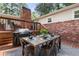Enjoy al fresco dining on this deck featuring a grill and wooden dining table with seating at 839 Cardova Ne Dr, Atlanta, GA 30324