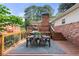Outdoor wooden deck, complete with dining table, chairs, and a grill, great for gatherings at 839 Cardova Ne Dr, Atlanta, GA 30324