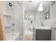 Stylish bathroom with a shower-tub, modern vanity, and beautiful wainscoting at 839 Cardova Ne Dr, Atlanta, GA 30324