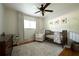Charming bedroom with wooden crib, accent chair, and neutral color palette at 839 Cardova Ne Dr, Atlanta, GA 30324