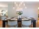 Elegant dining room with a modern chandelier, seating for six, and stylish decor at 839 Cardova Ne Dr, Atlanta, GA 30324