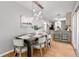 Stylish dining room with contemporary lighting and seamless flow to the kitchen at 839 Cardova Ne Dr, Atlanta, GA 30324