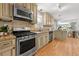 Charming kitchen features stainless appliances, stone countertops, and a seamless flow to the breakfast nook at 839 Cardova Ne Dr, Atlanta, GA 30324