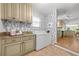 Convenient laundry space off the kitchen, complete with granite countertops and storage at 839 Cardova Ne Dr, Atlanta, GA 30324