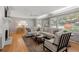 Cozy living room featuring a fireplace, neutral-toned sectional sofa, and abundant natural light at 839 Cardova Ne Dr, Atlanta, GA 30324