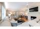 Bright and airy living room with fireplace, tv, and seamless flow to the dining area at 839 Cardova Ne Dr, Atlanta, GA 30324