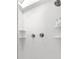 Clean white tiled shower showcasing built-in shelving, a rain shower head, and modern fixtures at 839 Cardova Ne Dr, Atlanta, GA 30324