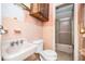 Retro bathroom featuring pink tile, classic fixtures, and a shower/tub combo at 270 Bromack Se Dr, Atlanta, GA 30315