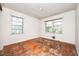 This bedroom features hardwood floors and windows that let in plenty of natural light at 270 Bromack Se Dr, Atlanta, GA 30315