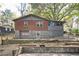 Two-story home with brick and gray siding, featuring a garage, a partially completed pool, and a fenced yard at 270 Bromack Se Dr, Atlanta, GA 30315