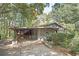 Single-story home with stone facade and covered porch, set in a wooded landscape at 270 Bromack Se Dr, Atlanta, GA 30315