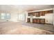 Open concept kitchen with classic wood cabinets adjacent to a spacious living area at 270 Bromack Se Dr, Atlanta, GA 30315