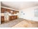 View of the kitchen featuring wood cabinets and a white door leading to the exterior at 270 Bromack Se Dr, Atlanta, GA 30315