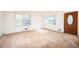 Bright living room features hardwood floors, large windows, and a classic wood door at 270 Bromack Se Dr, Atlanta, GA 30315