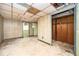 View of an unfinished room with linoleum flooring, panel walls and fluorescent lighting at 270 Bromack Se Dr, Atlanta, GA 30315