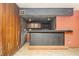 View of the wet bar with panel walls and a view into the living room at 270 Bromack Se Dr, Atlanta, GA 30315
