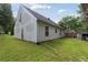 An expansive backyard offers outdoor possibilities with its lush lawn and mature trees at 3530 Boulder Cir, Ellenwood, GA 30294