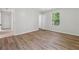 Bedroom featuring hardwood floors, neutral paint, and window view at 3530 Boulder Cir, Ellenwood, GA 30294