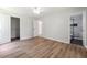 Bedroom featuring hardwood floors, neutral paint, and bathroom access at 3530 Boulder Cir, Ellenwood, GA 30294