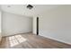 Bright bedroom featuring hardwood floors, closet, and neutral paint at 3530 Boulder Cir, Ellenwood, GA 30294