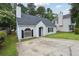 Attractive single-story home featuring a gray roof, vinyl siding, green lawn, and an asphalt driveway at 3530 Boulder Cir, Ellenwood, GA 30294