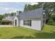 Well-maintained home with a gray roof, vinyl siding, and a lush green lawn showcasing its curb appeal at 3530 Boulder Cir, Ellenwood, GA 30294