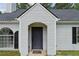 Inviting front entry with gray door, black hardware, arched entry, and a clear view into the residence at 3530 Boulder Cir, Ellenwood, GA 30294