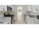 Bright kitchen with stainless steel appliances and granite countertops at 3530 Boulder Cir, Ellenwood, GA 30294