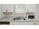 Modern kitchen with stainless steel sink and granite countertops at 3530 Boulder Cir, Ellenwood, GA 30294