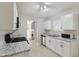 Well-lit kitchen featuring white cabinets, granite countertops, and stainless steel appliances at 3530 Boulder Cir, Ellenwood, GA 30294