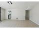Spacious living room with tile flooring, neutral walls, and an open layout for versatile living at 3530 Boulder Cir, Ellenwood, GA 30294