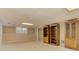 Finished basement with plush carpet, built-in shelves, window and door offers ample living space at 4259 Arbor Club Dr, Marietta, GA 30066