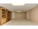 Finished basement featuring neutral walls, plush carpeting, and built-in bookshelves offers storage at 4259 Arbor Club Dr, Marietta, GA 30066