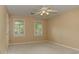 Bedroom with carpet, two windows with shutter-style blinds, and a ceiling fan at 4259 Arbor Club Dr, Marietta, GA 30066