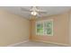 Inviting bedroom featuring neutral walls, plush carpeting, and window with wood views for serene living at 4259 Arbor Club Dr, Marietta, GA 30066