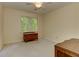 Bright bedroom with a window overlooking a wooded area offers natural light and calming views at 4259 Arbor Club Dr, Marietta, GA 30066
