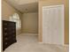 Bedroom with plush carpet, traditional dresser, and a double door closet at 4259 Arbor Club Dr, Marietta, GA 30066