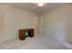 Clean bedroom featuring a desk, and a door opening to another room at 4259 Arbor Club Dr, Marietta, GA 30066