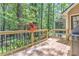 Beautiful outdoor deck with wooden railing featuring a flower pot on the side, next to the grill at 4259 Arbor Club Dr, Marietta, GA 30066