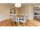 Traditional dining room featuring hardwood floors and stylish wallpaper at 4259 Arbor Club Dr, Marietta, GA 30066