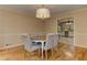 Dining room featuring a round table, upholstered chairs, and hardwood floors at 4259 Arbor Club Dr, Marietta, GA 30066