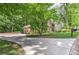 Long driveway leading to a brick home with an attached two car garage and well-maintained lawn at 4259 Arbor Club Dr, Marietta, GA 30066